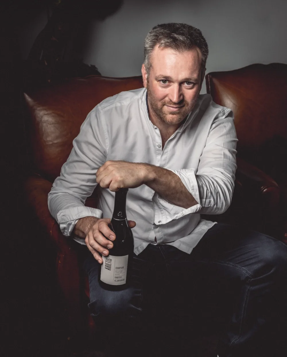 Alexis Leconte mit Champagnerflasche